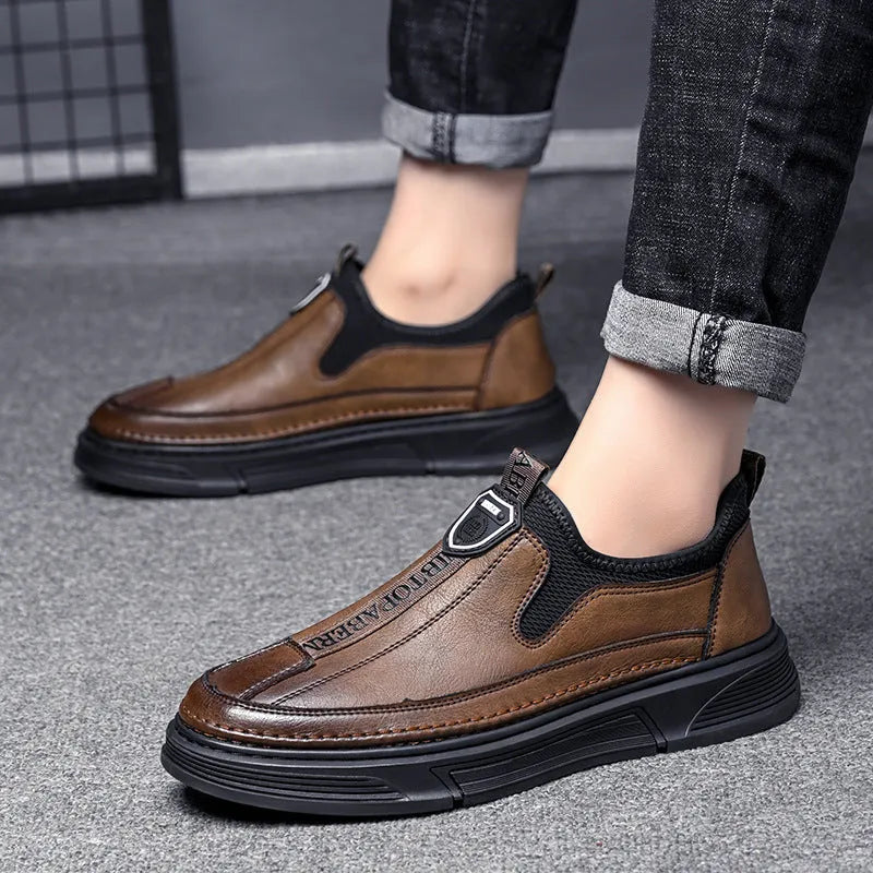 Men's solid colour leather casual shoes with round toe design in black or brown options