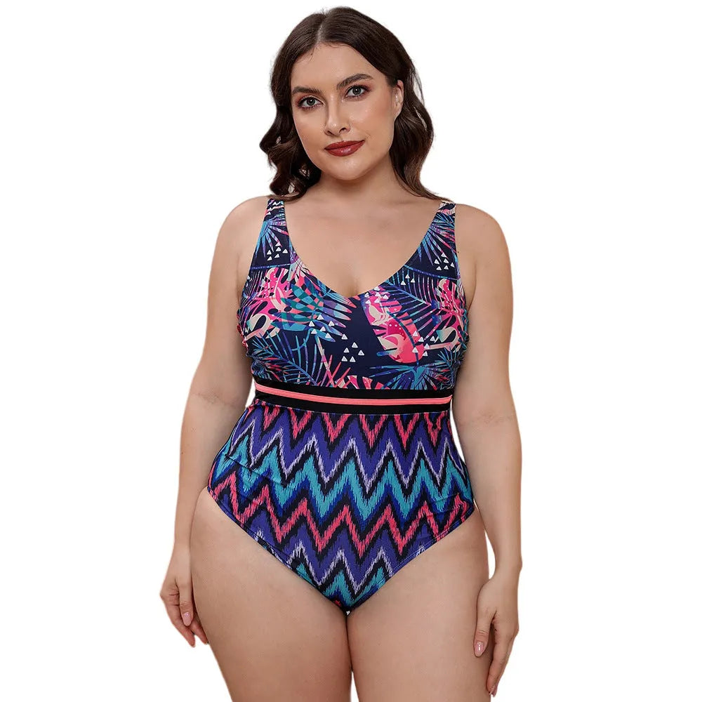 Women's blue printed one-piece swimsuit with spaghetti straps on a mannequin.
