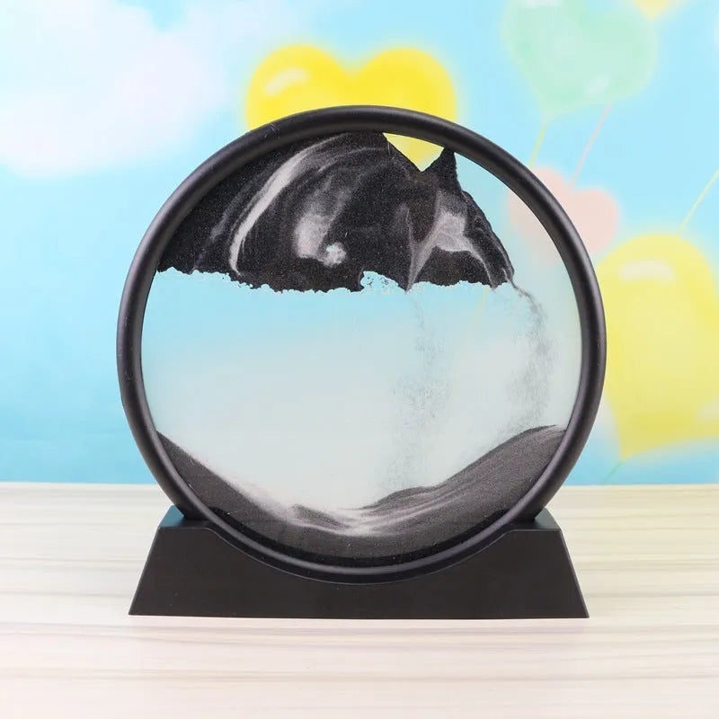 3D dynamic sand painting in glass frame with shifting blue and purple sand patterns