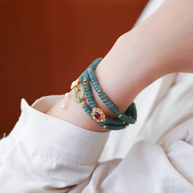 Blue water jade abacus bead and tourmaline ring bracelet with pearls under 4mm.