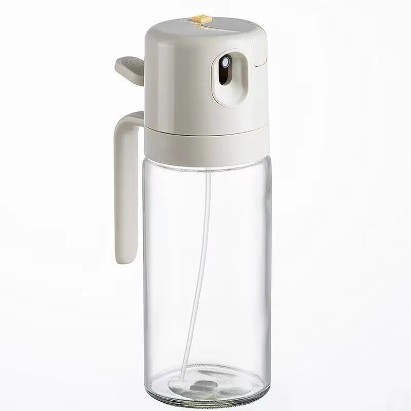Warm grey 550ml glass oil sprayer bottle with switchable spray/pour cap on kitchen counter