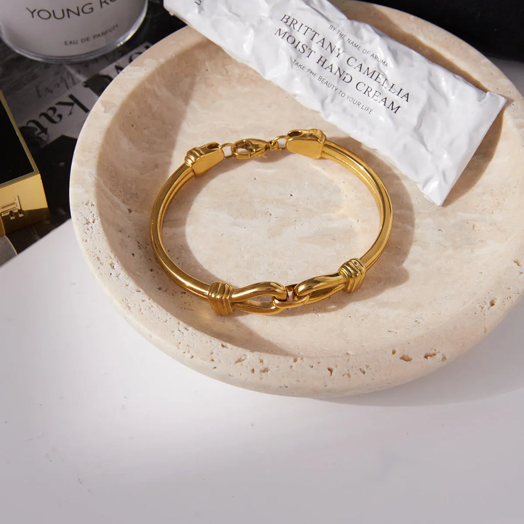 Light luxury stainless steel bracelet with buckle, electroplated finish, connection design, on white background