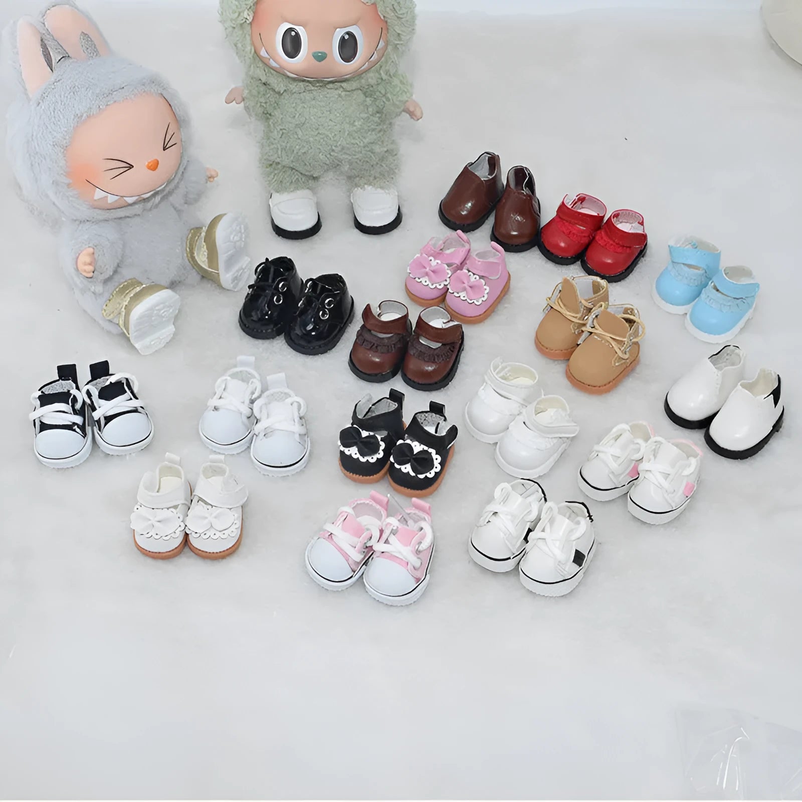 A pair of miniature PU/polyurethane doll shoes for 17cm scale keychain figures.