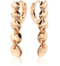 A pair of long, round circle-shaped retro earrings in a gold colour, made from woven copper