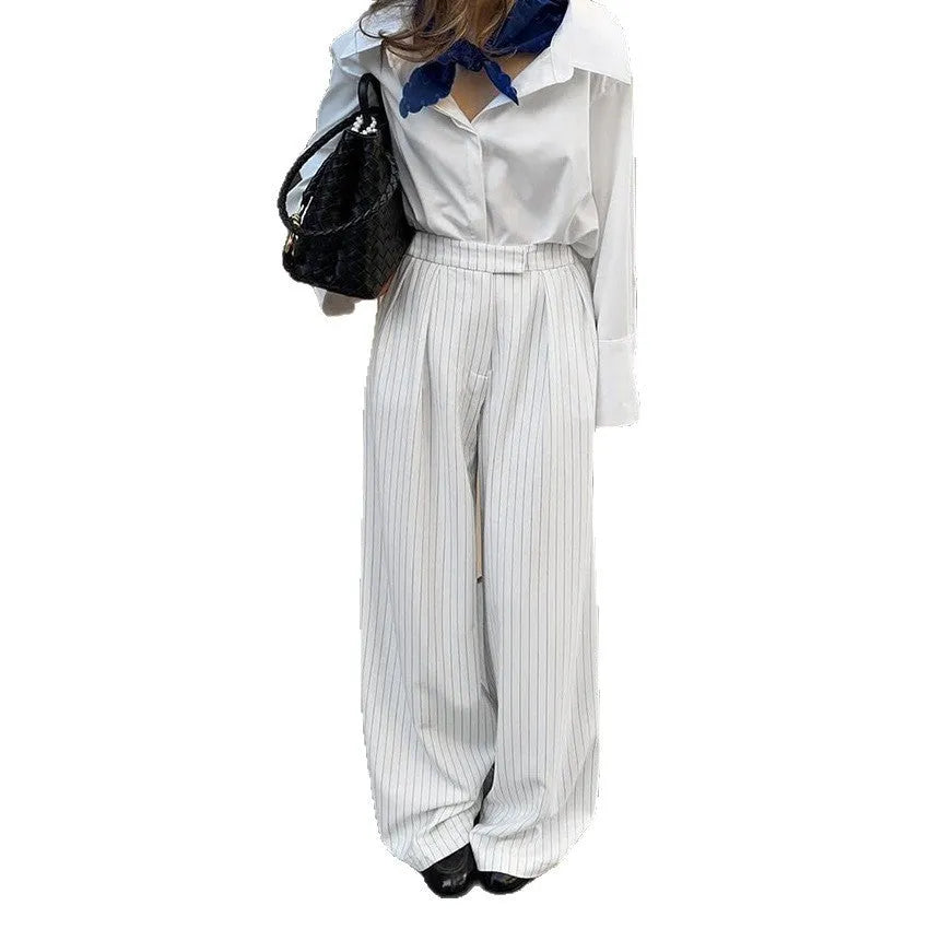 White striped wide-leg trousers with zipper detailing on loose casual silhouette