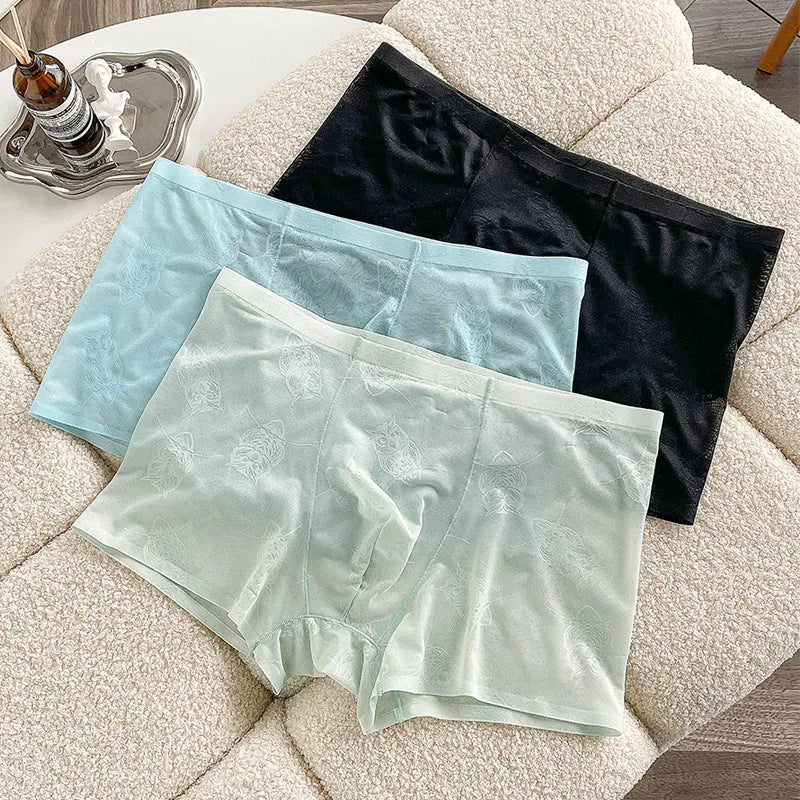 Men's ice silk seamless boxers in black, lightweight nylon fabric with mid-waist design