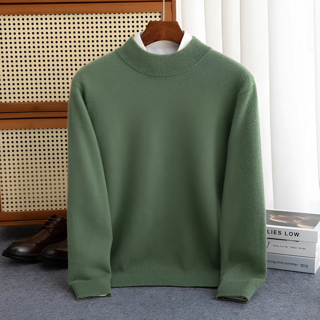 A man wearing a half-collar loose-fit wool sweater in a light business style, shown in a neutral colour.