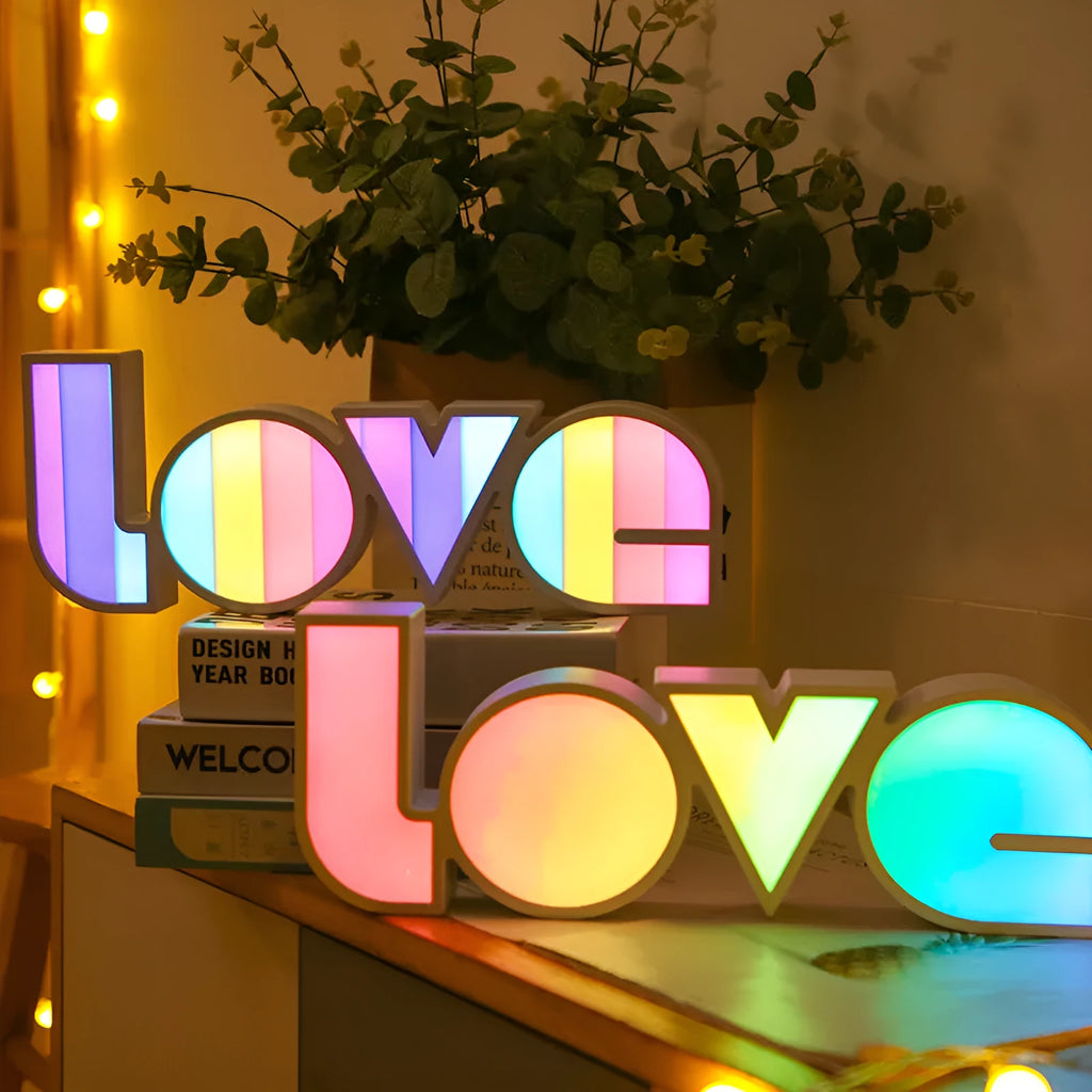 LED LOVE light decoration with rainbow-style lampshade showing romantic room illumination