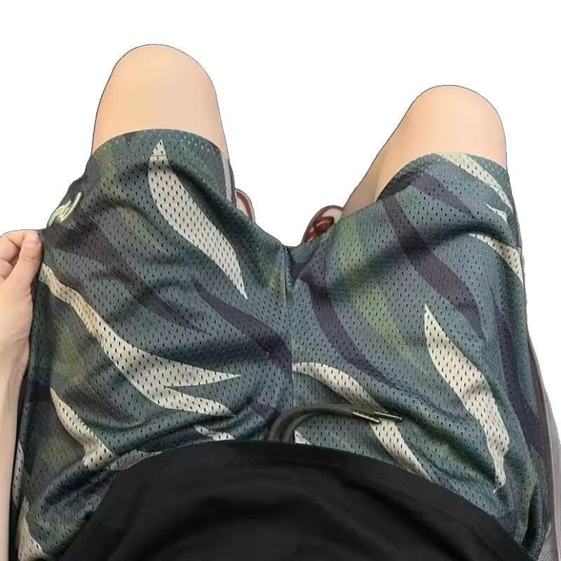 Men's camouflage pattern mesh shorts with straight leg cut in cotton blend polyester fabric