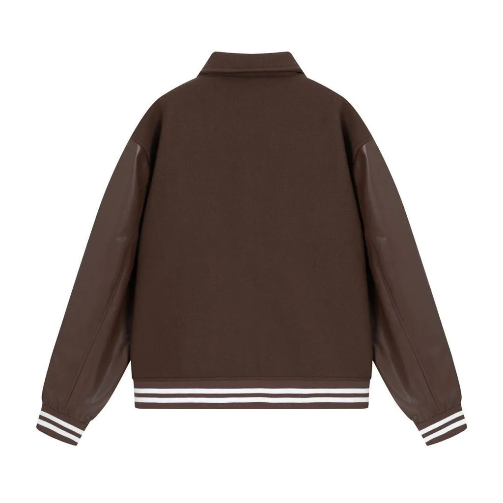 Women's apricot woollen jacket with white bone embroidery on the front.