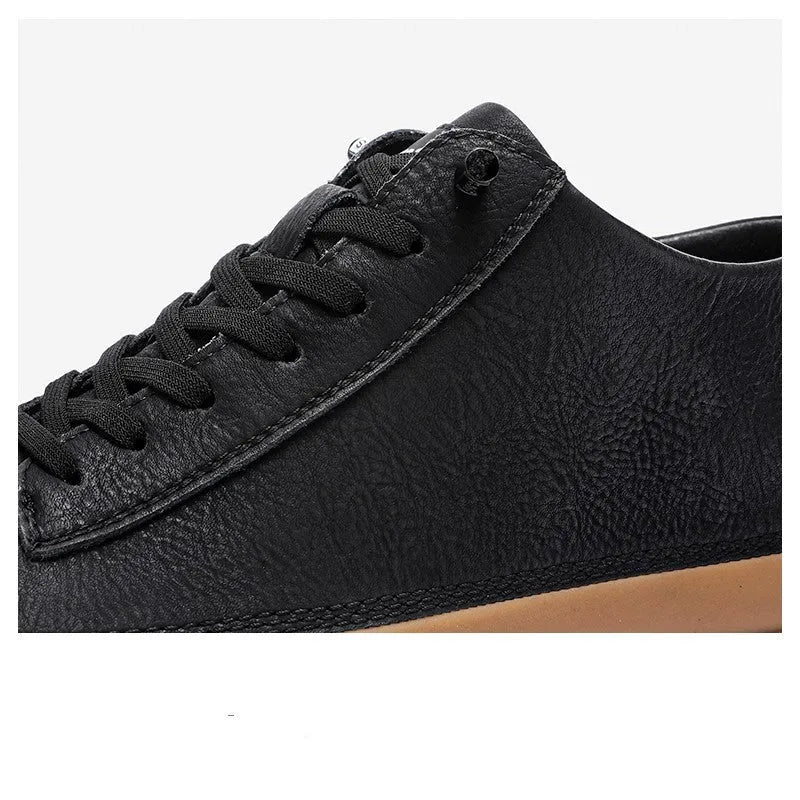 Men's black leather casual shoes with a round toe, flat heel, and lace-up closure on a rubber sole.