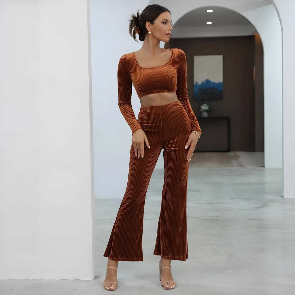 Caramel-coloured women's long sleeve knit sweater and matching trousers laid flat, a two-piece loungewear set.