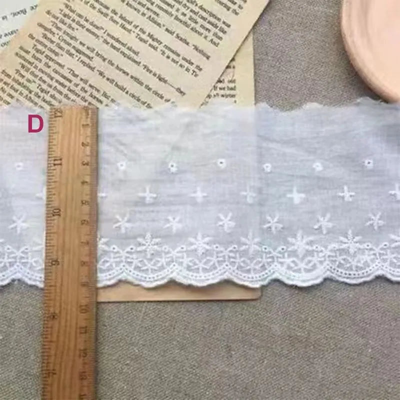 Cotton embroidered lace trim roll showing four different openwork pattern styles for DIY clothing