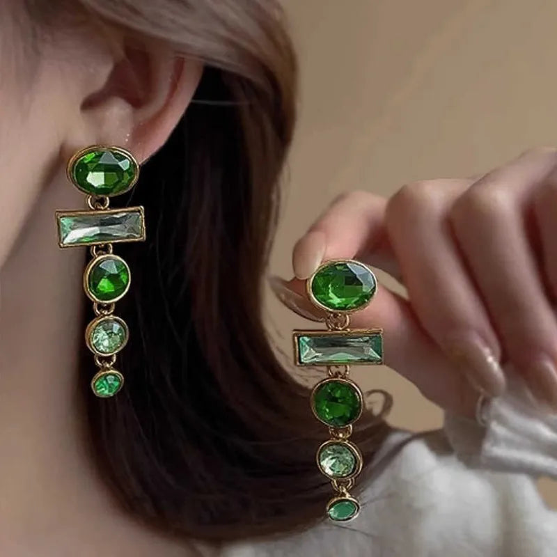 Pair of green gradient geometric alloy earrings with inlaid zircon stones and a dangling tassel.