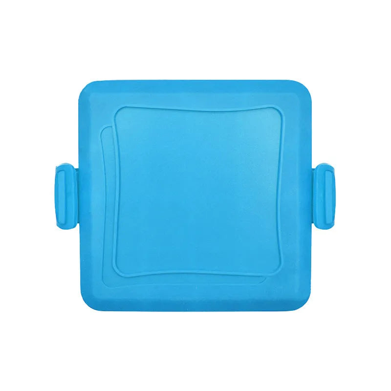 Red silicone baking tray and matching heat-resistant gloves set on kitchen counter