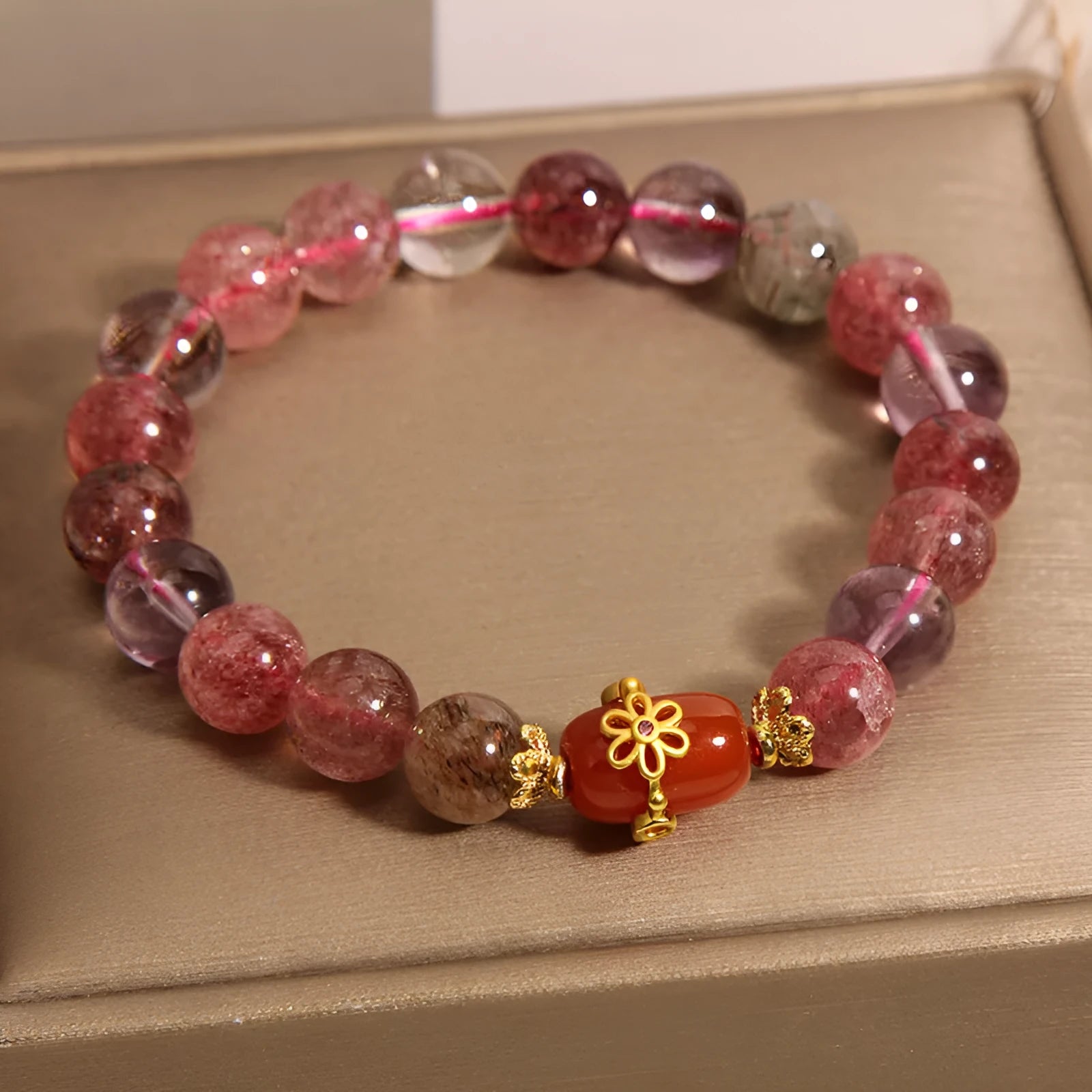Natural Super Seven crystal bracelet with red agate and white stones in a cartoon style.