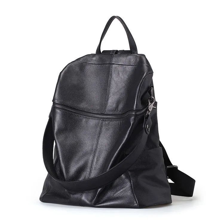 Genuine leather retro-style women's backpack showing front sandwich pocket and brown leather texture.