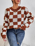 Dark brown loose-fit pullover sweater with a plaid chessboard pattern and long sleeves.