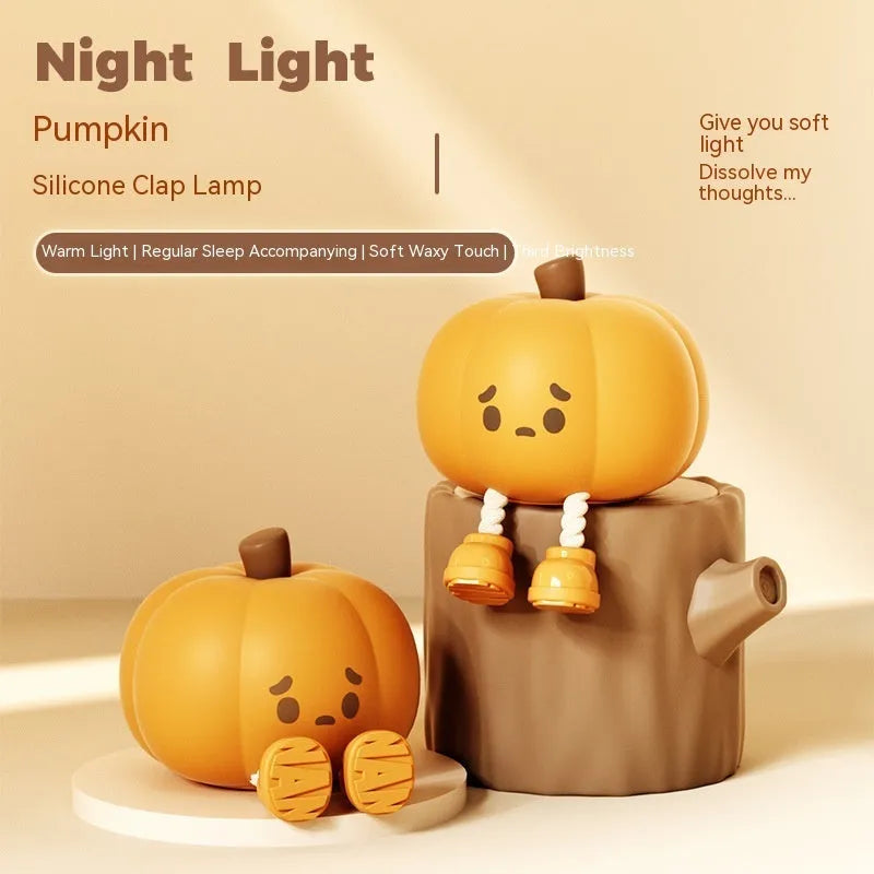 Orange silicone pumpkin-shaped night light with USB charging cable