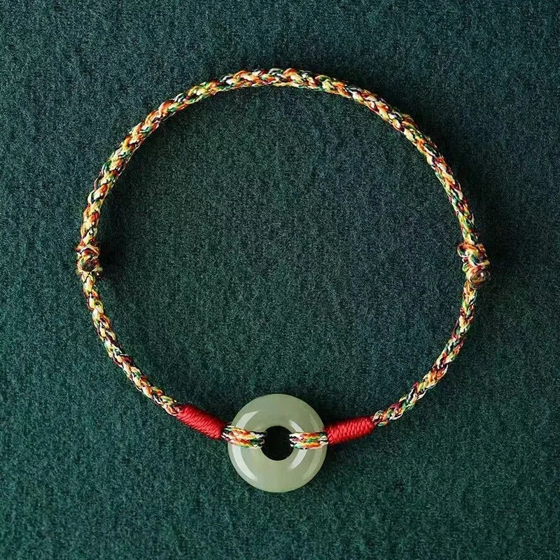 Handmade colourful rope bracelet with peace buckle on woven braided design