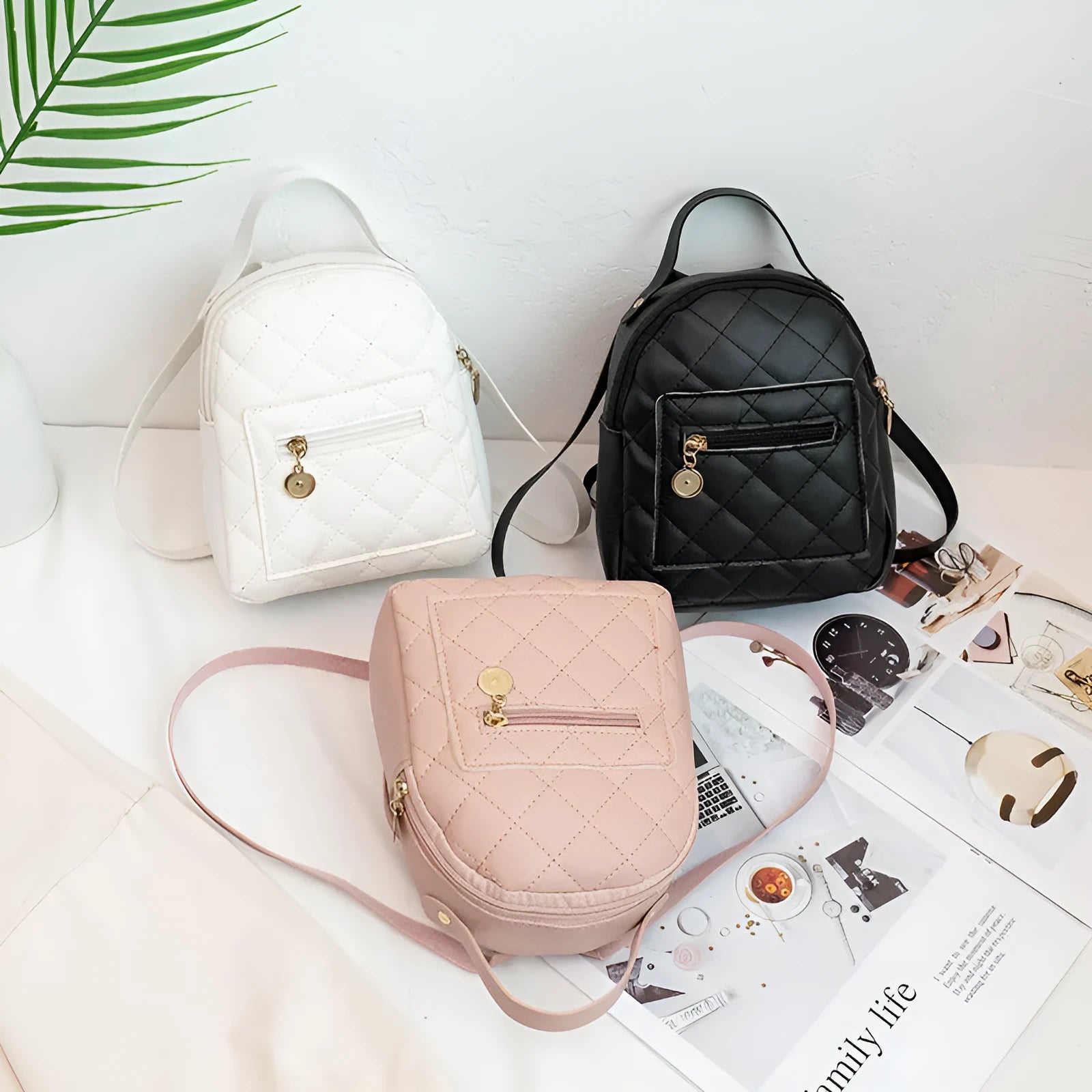 Hard square girls backpack with embroidered floral design in pink colour.