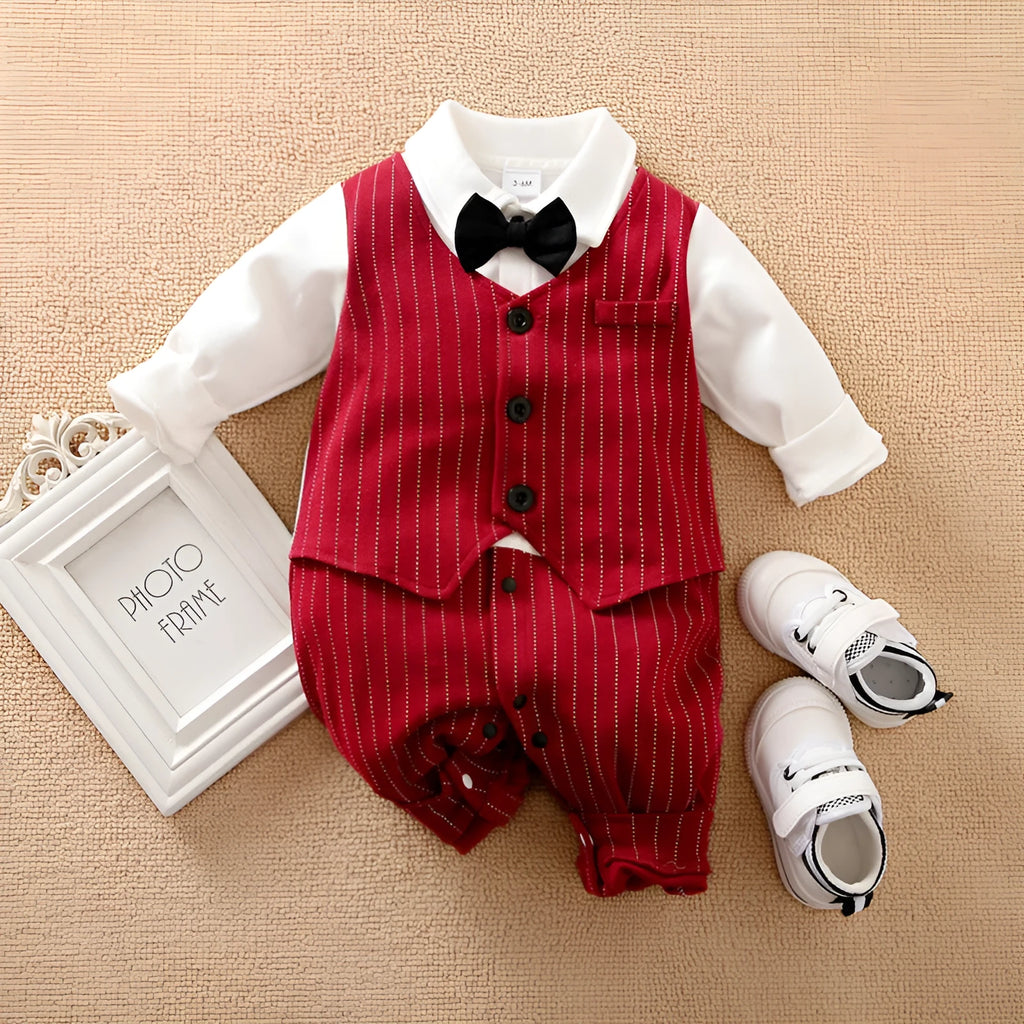Baby boy wearing a wine red cotton gentleman jumpsuit with long sleeves and single-breasted closure.