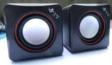 Small square black USB-powered 2.0 computer speaker for PC desktop.
