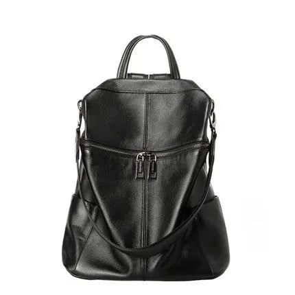 Genuine leather retro-style women's backpack showing front sandwich pocket and brown leather texture.