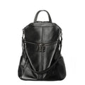 Genuine leather retro-style women's backpack showing front sandwich pocket and brown leather texture.