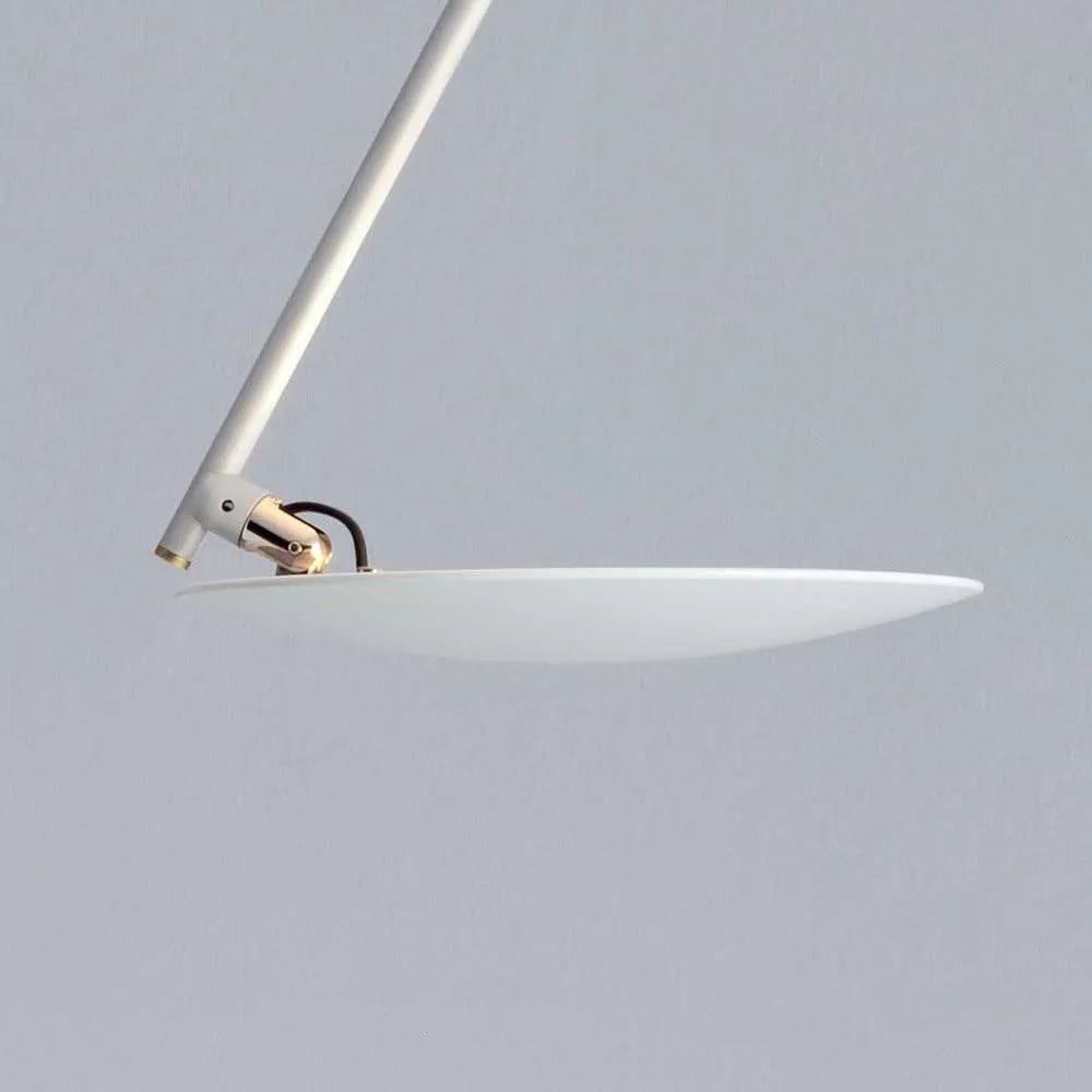 Modern round iron ceiling lamp with a white finish, mounted flush against a ceiling.