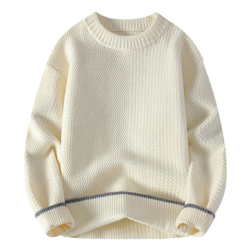 Man wearing a grey loose-fit round neck men's pullover sweater.