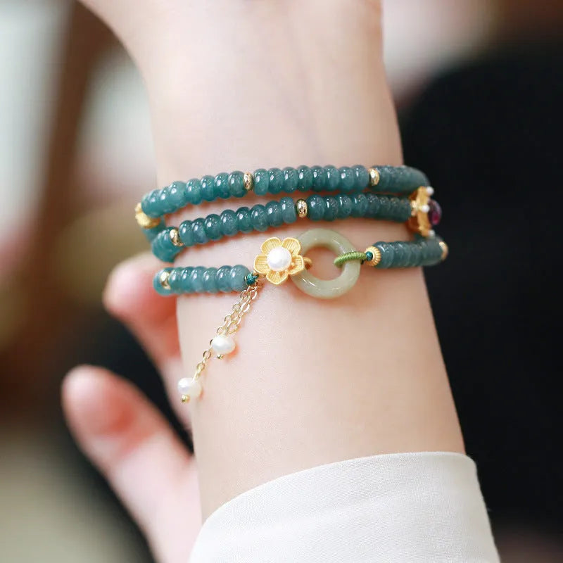Blue water jade abacus bead and tourmaline ring bracelet with pearls under 4mm.
