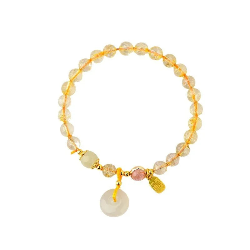 Gold rutilated quartz geometric crystal bracelet with peace buckle safety clasp and pendant charm