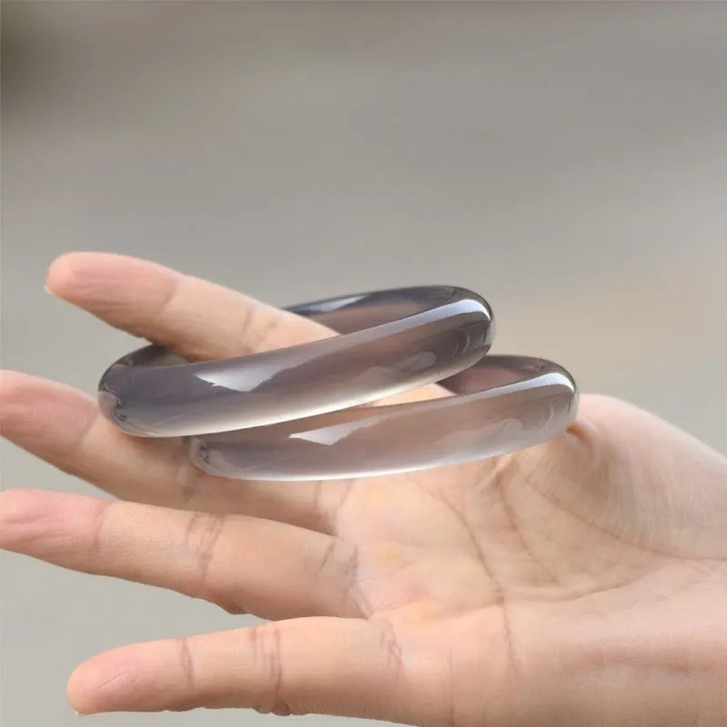Dark grey iced chalcedony agate women's bracelet with circle, ring and line design elements