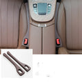 Car seat gap filler strip in polyresin with handle, shown in available colour options