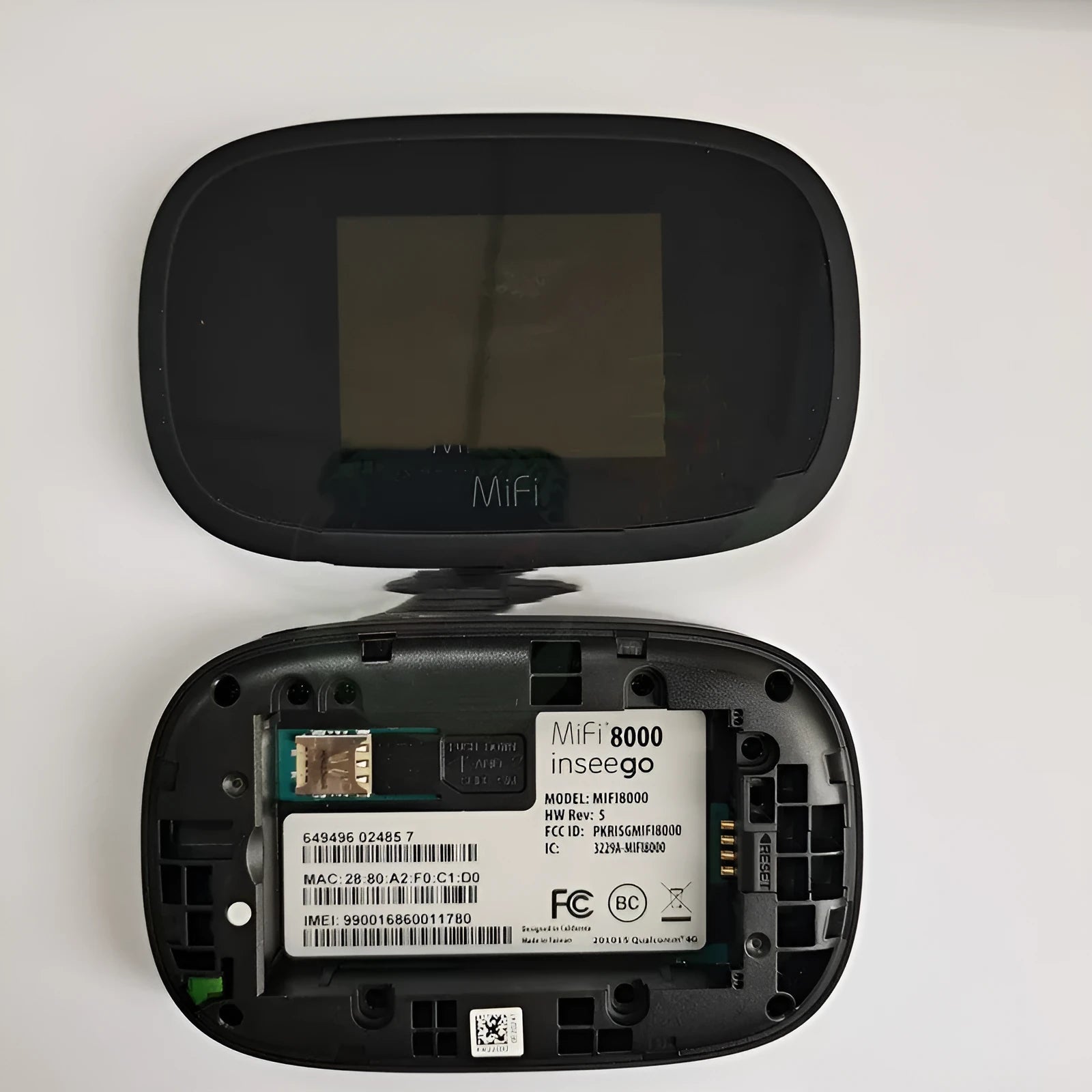 Black mifi8000 portable 4G wireless router with compact design on a table