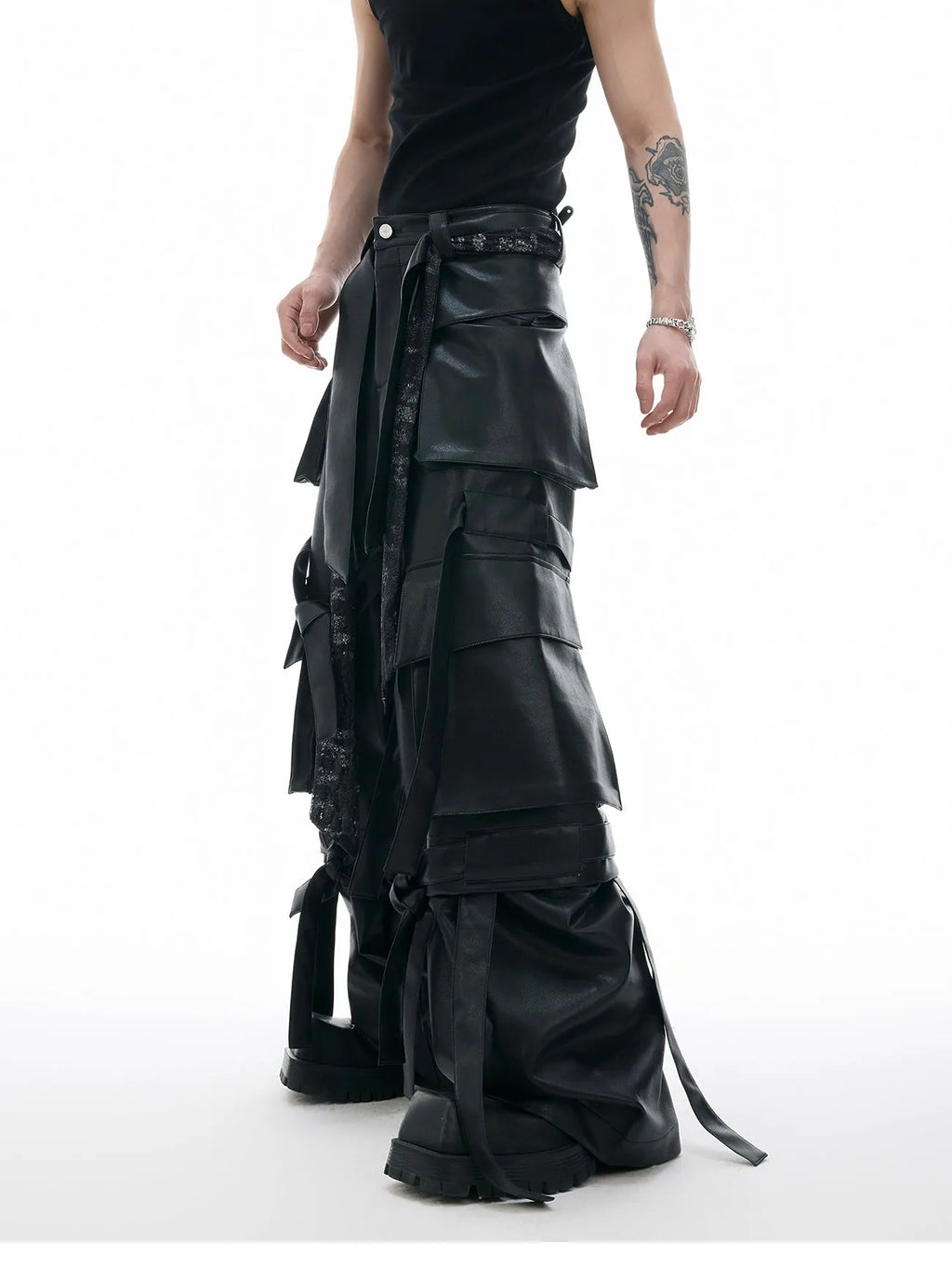 Black loose-fit multi-pocket trousers with quilted stitch detailing on a mannequin.