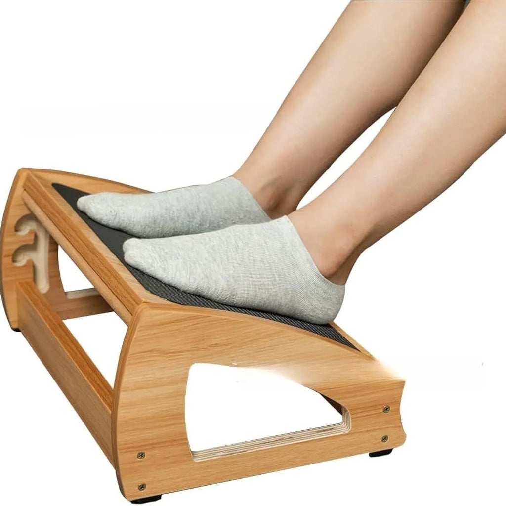 Wooden adjustable height office desk footstool in a natural wood colour.