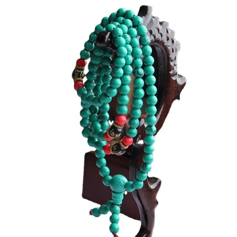 Turquoise Tibetan bracelet with 108 synthetic stone powder beads in 6mm and 8mm sizes
