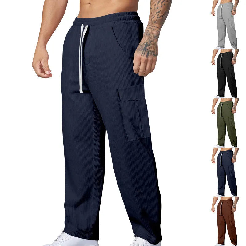 Men's straight-leg corduroy trousers in navy blue with an elasticated drawstring waist.