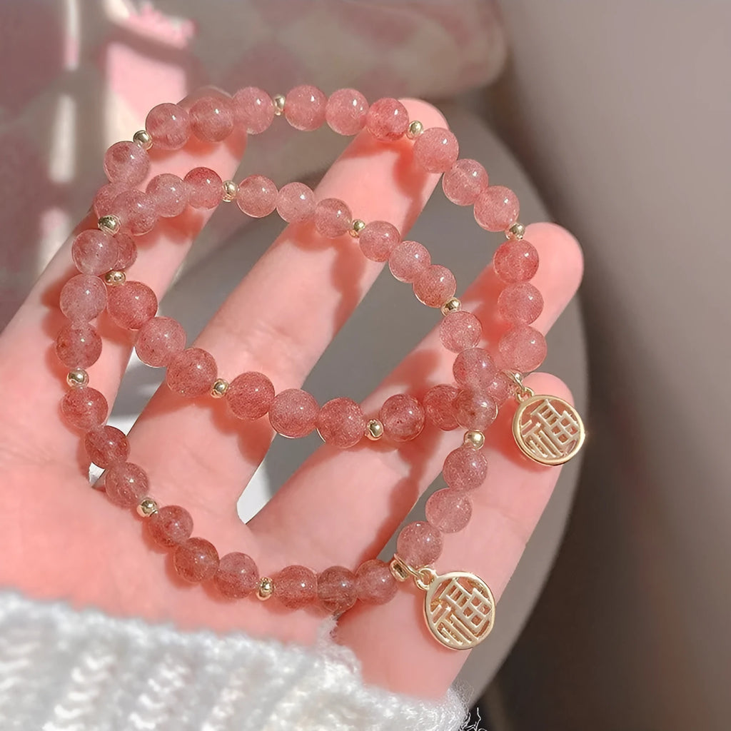 Handmade strawberry quartz blessing card bracelet with glass construction and adjustable universal wrist size