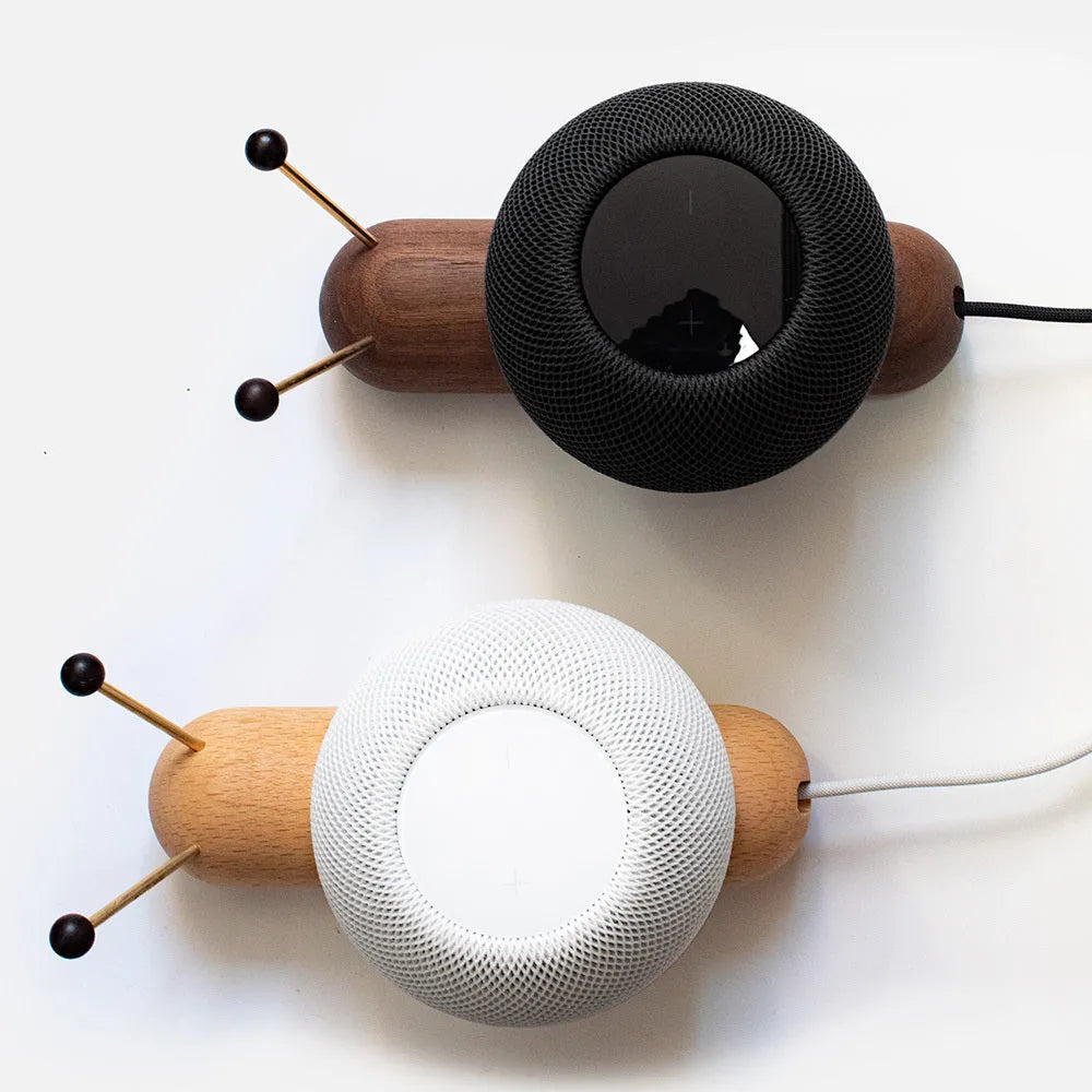 Khaki brown non-slip desktop bracket for holding a HomePod-sized Bluetooth speaker.