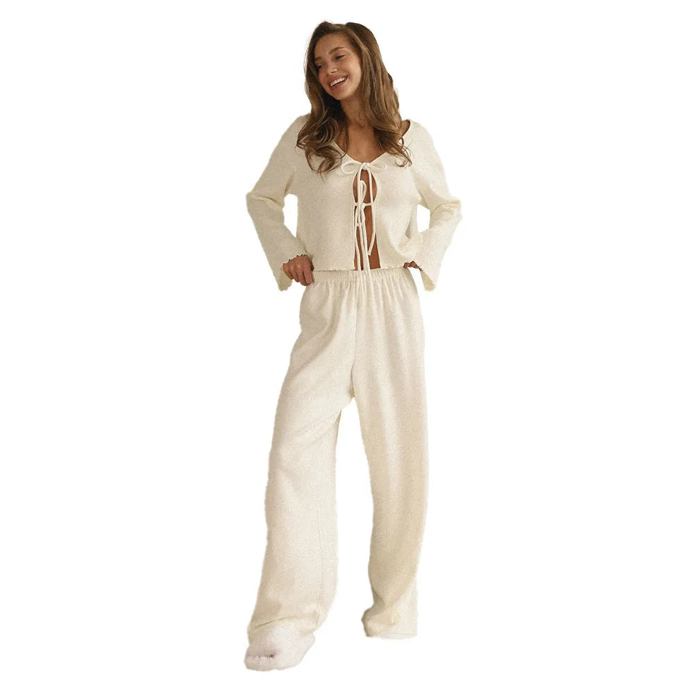 Women's long sleeve pajama set in gray, made of polyester blend, with top and pants.