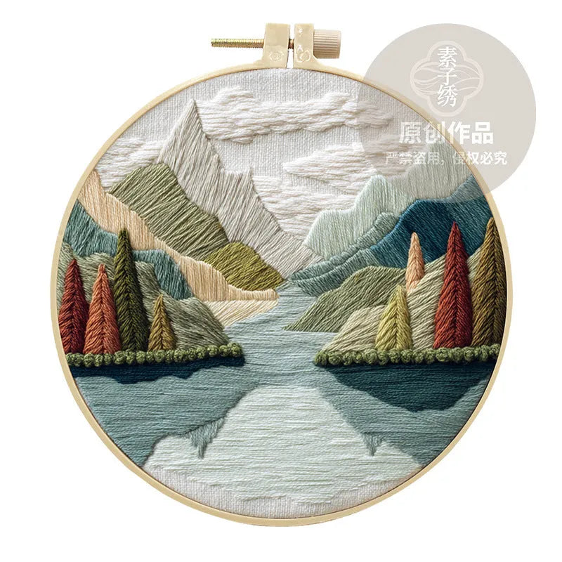 Embroidery DIY kit with landscape-printed cotton fabric, embroidery threads, and needles for handmade cloth art