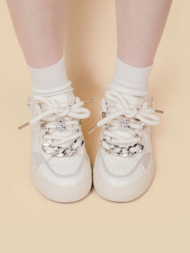Casual white low-top lace-up sneakers for women with rubber sole and thick bottom heel