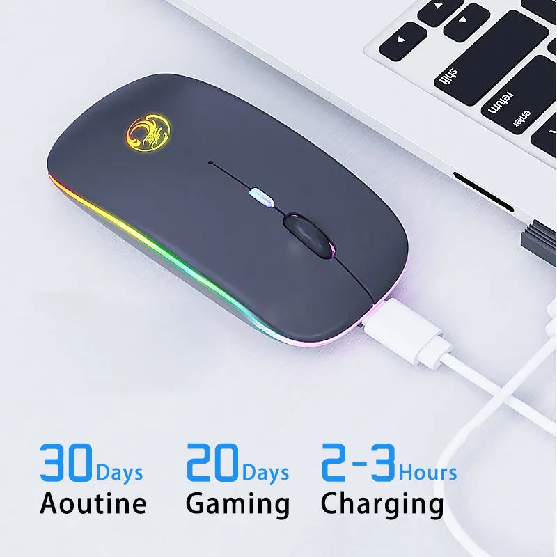 Black or white luminous charging dual-mode silent wireless mouse on a desk next to a laptop, showing its compact 112x57x25mm size.