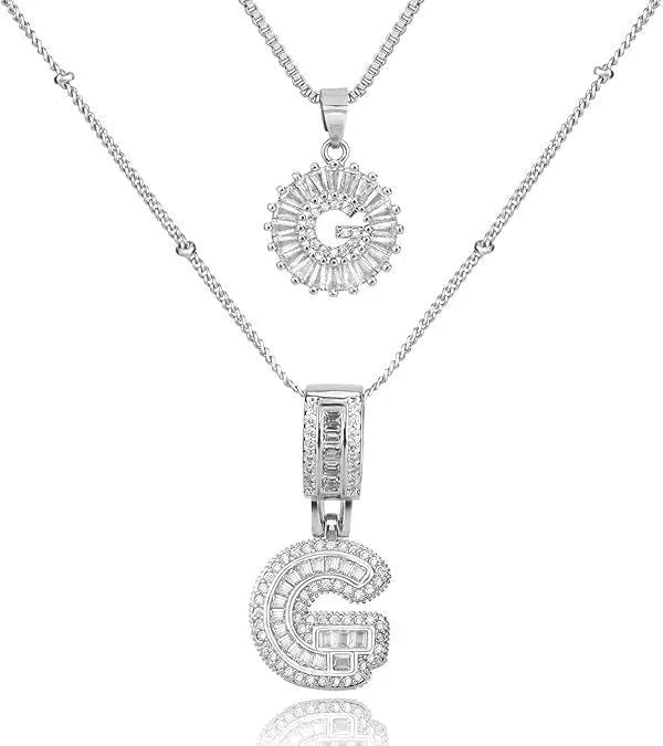 26 English letters copper-plated gold diamond initial pendant necklace with adjustable chain on display