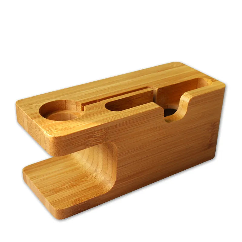 Bamboo desk stand holding a watch and smartphone on an office desk