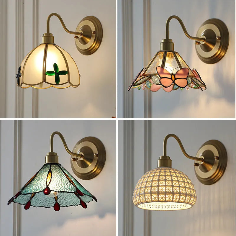 Retro brass glass wall lamp with stone pattern shade in transparent colour, mounted on a wall