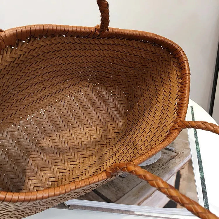 Genuine leather bucket handbag in black, brown, coffee, or white, available in 40x22x15cm and 35x19x14cm sizes